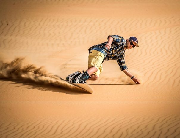 Sandboarding in morocco desert